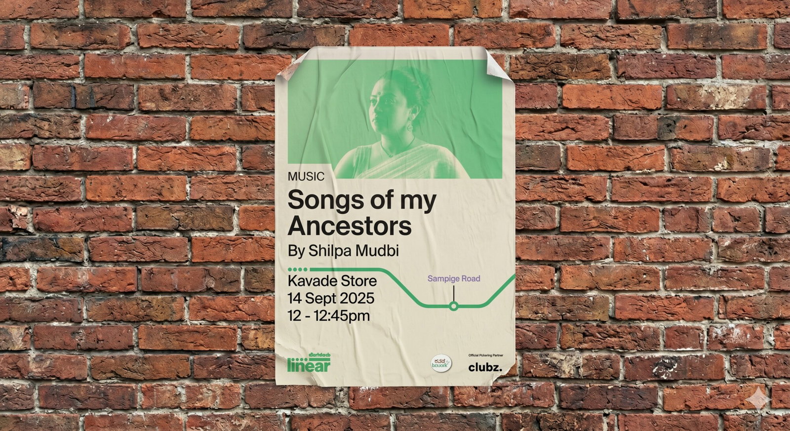 A Linear event poster pasted on a brick wall, 'Songs of my Ancestors' by Shilpa Mudbi, with a metro line marking the venue stop at Sampige Road